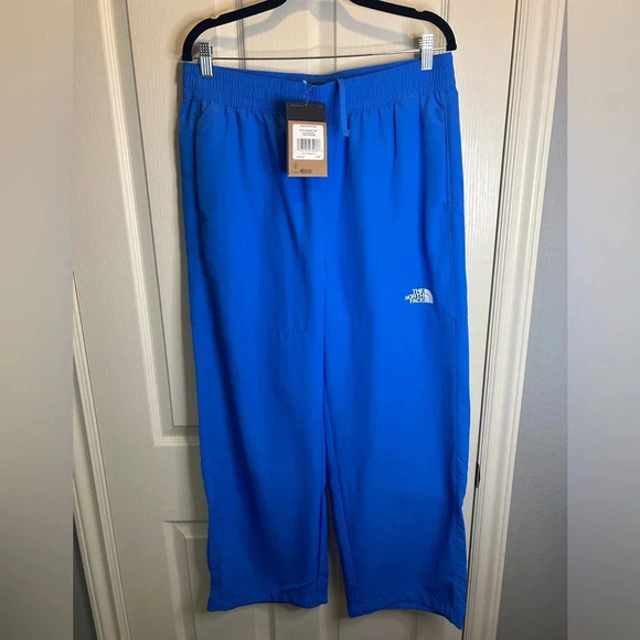 💦”North Face” NWT Women’s Blue Nylon Easy Wind Pant Flashdry w/ Pockets Size L💙 - Picture 1 of 16